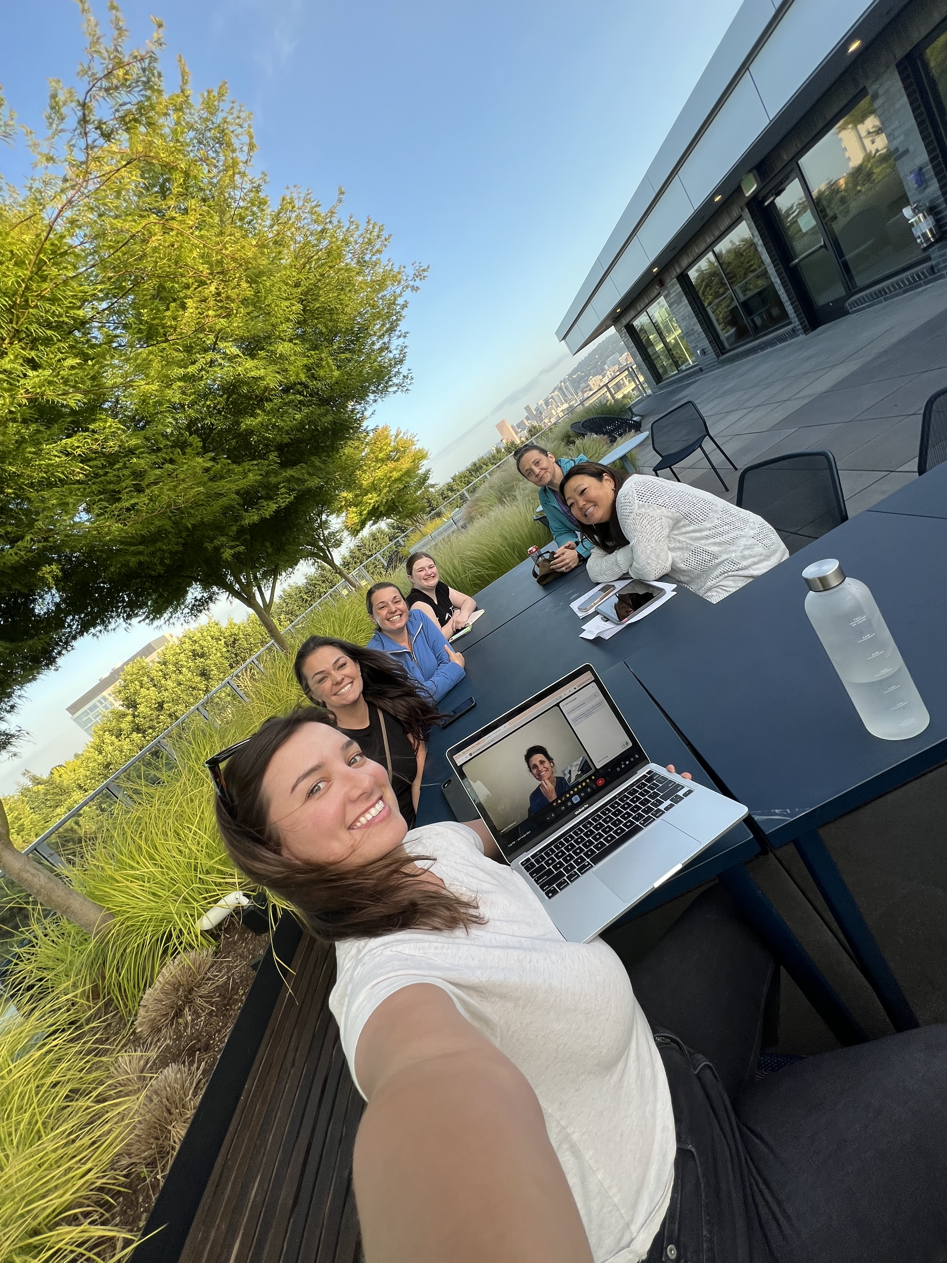 Women connecting at a rooftop meetup